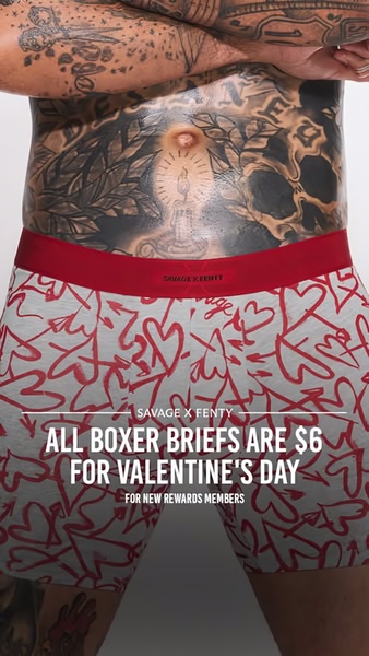 A close-up shot of a model wearing heart-patterned boxer briefs with a text overlay promoting a $6 price point for new rewards members.